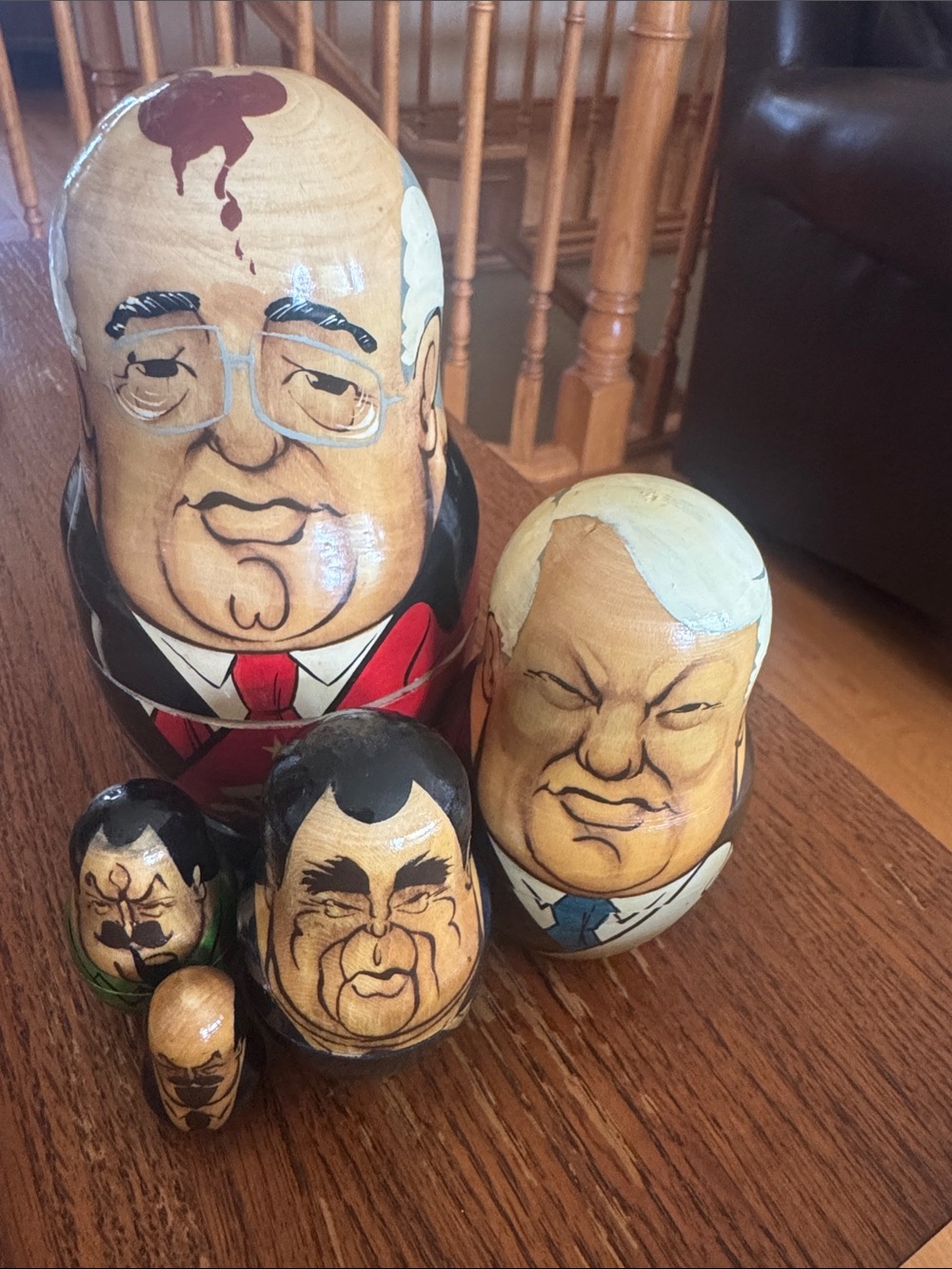 Russian Political Hand-Painted Wooden Nesting Dolls in Beige, Black, Red